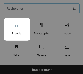 Interface utilisateur montrant une barre de recherche en haut et plusieurs icônes de fonctionnalités, dont une étiquette marquée 'Brands', sur un fond gris.